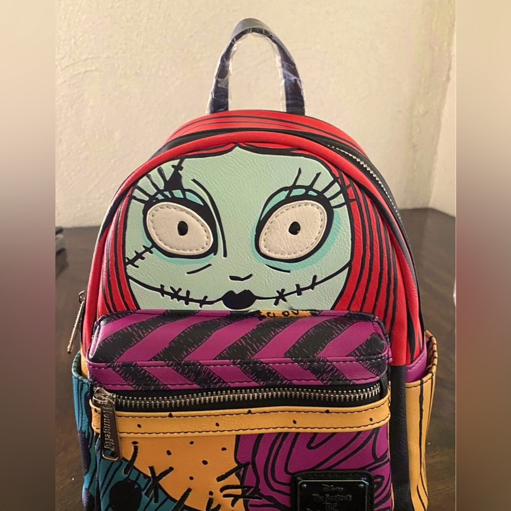 Loungefly Nightmare Before Christmas Mini Backpack. 11”H X 81/2” W X 4” D